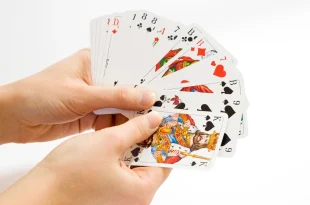 Free hands holding playing cards