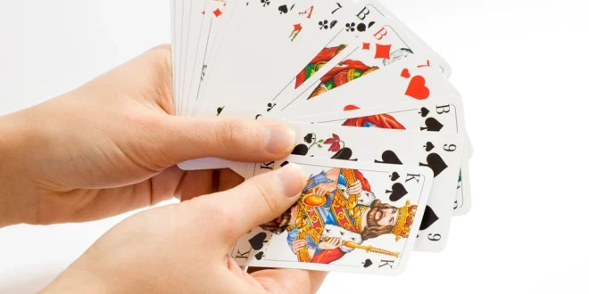 Free hands holding playing cards